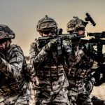 Army soldiers fighting scene on war with sunset background